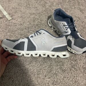 On Running White and Dark Gray Athletic Shoes